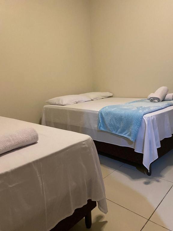Postel nebo postele na pokoji v ubytování Pousada Mineira