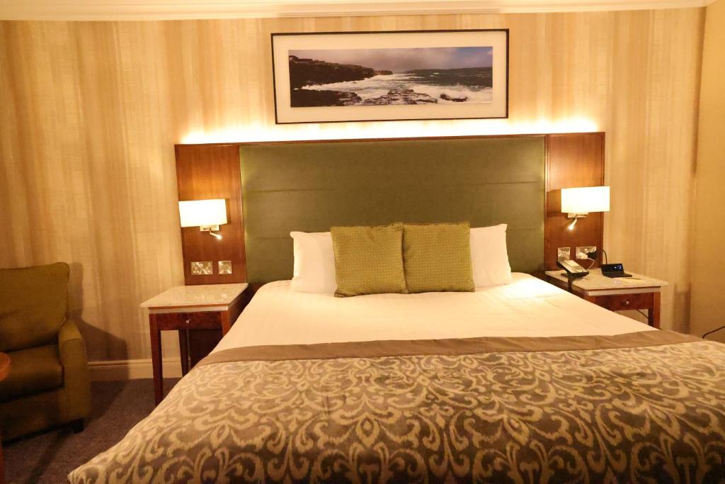 Voodi või voodid majutusasutuse Vaughan Lodge Hotel toas