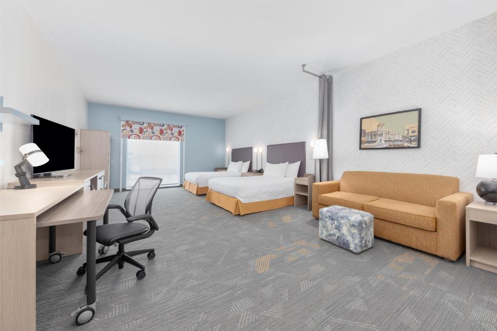 TV a/nebo společenská místnost v ubytování Home2 Suites By Hilton Paris