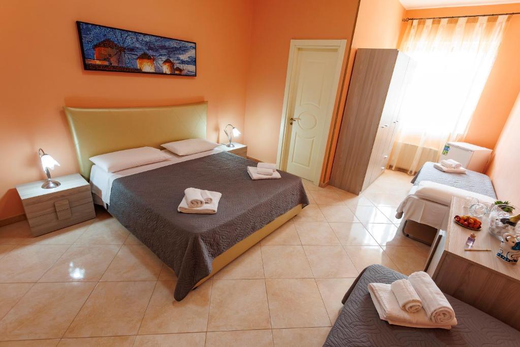 Postel nebo postele na pokoji v ubytování Petra Leccese - Art & Luxury Design B&B with Pool