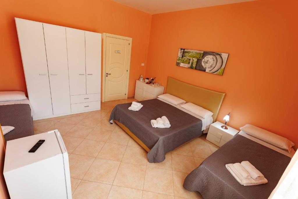 Postel nebo postele na pokoji v ubytování Petra Leccese - Art & Luxury Design B&B with Pool