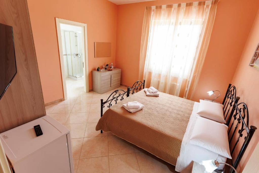 Postel nebo postele na pokoji v ubytování Petra Leccese - Art & Luxury Design B&B with Pool