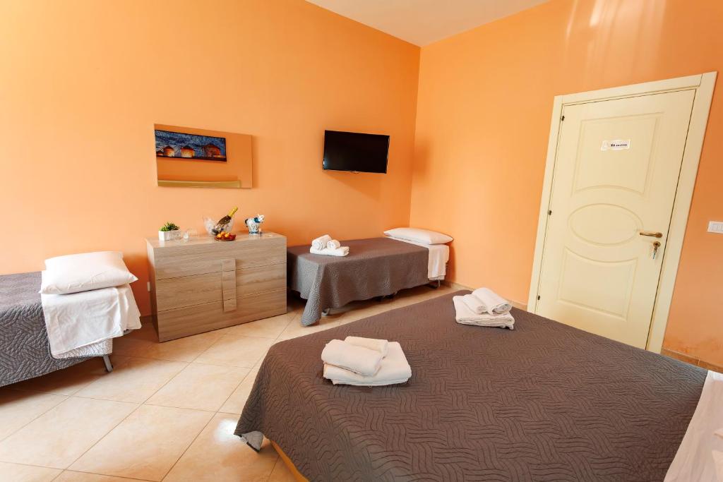 Postel nebo postele na pokoji v ubytování Petra Leccese - Art & Luxury Design B&B with Pool