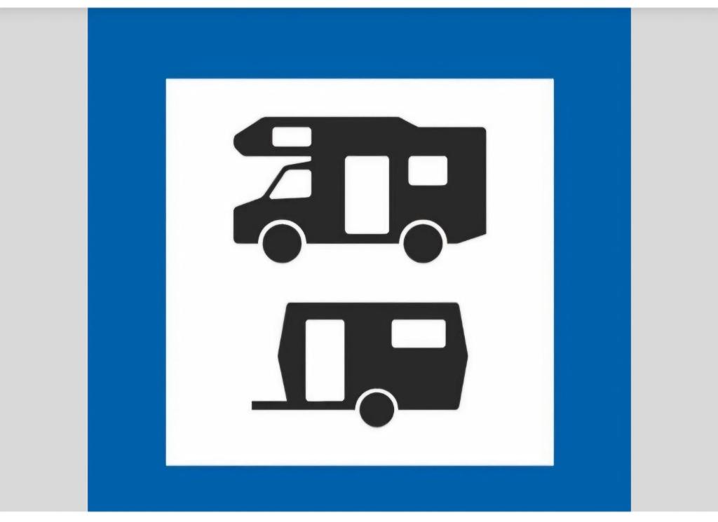 a blue and white sign with two trams at Wohnmobilstellplatz in Mecklenburg-Vorpommern - ab Juni Dixi WC in Carpin