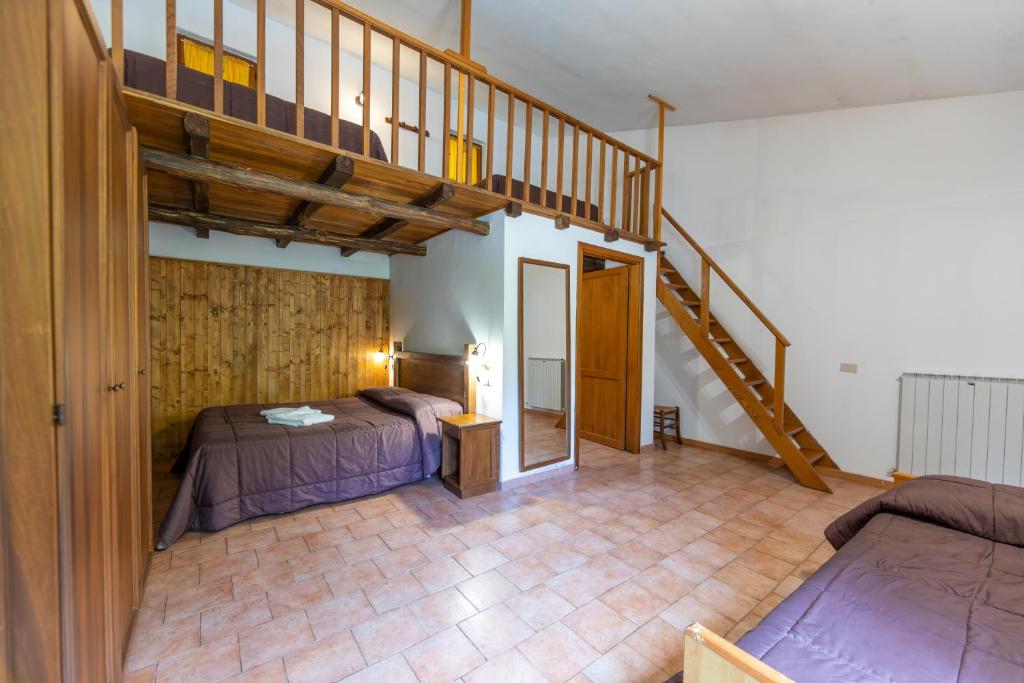 Postel nebo postele na pokoji v ubytování Agriturismo La Ferrera