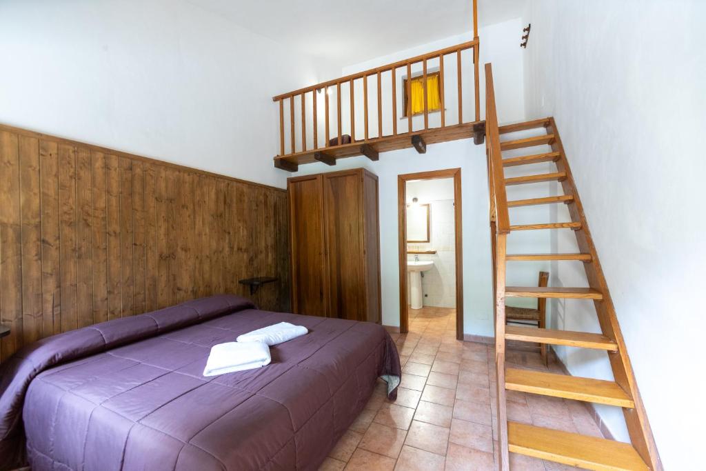 Postel nebo postele na pokoji v ubytování Agriturismo La Ferrera
