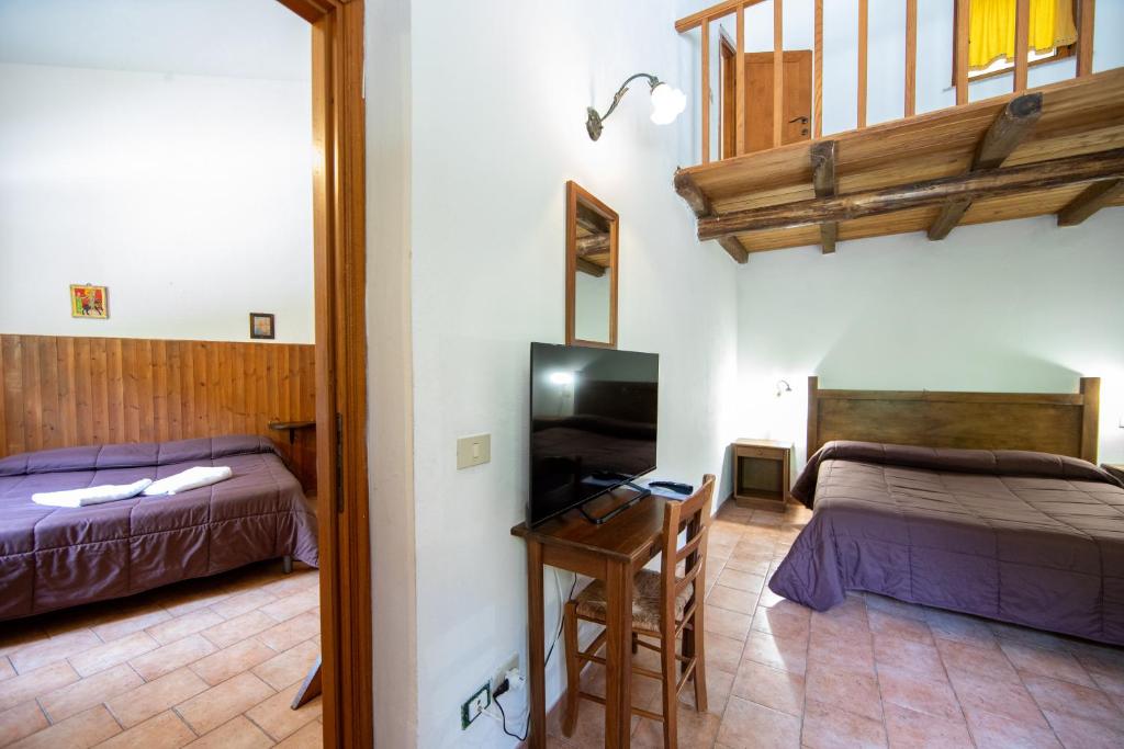 Postel nebo postele na pokoji v ubytování Agriturismo La Ferrera