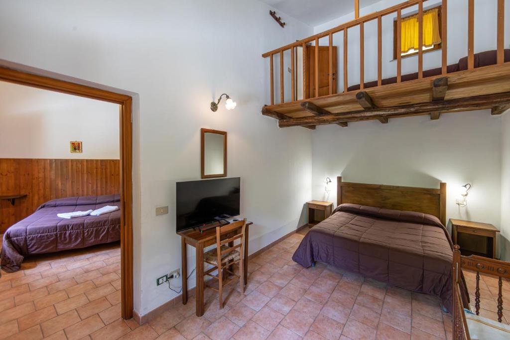 Postel nebo postele na pokoji v ubytování Agriturismo La Ferrera