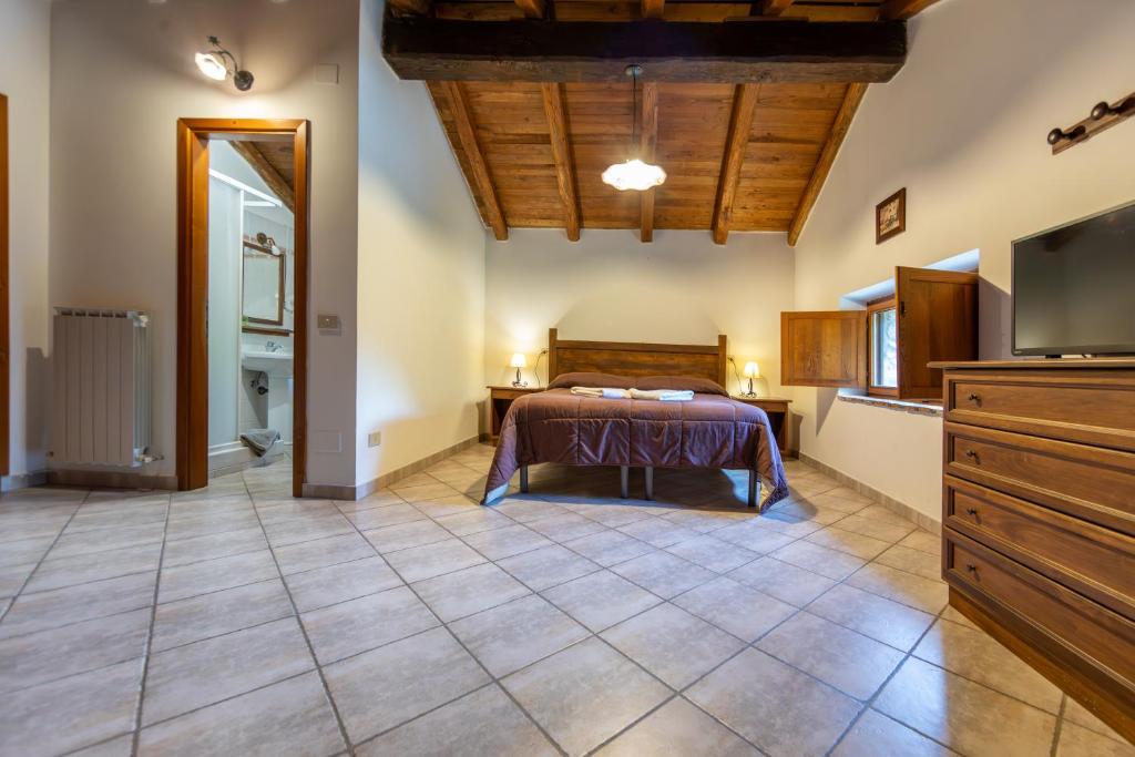 Postel nebo postele na pokoji v ubytování Agriturismo La Ferrera