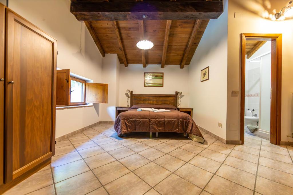 Postel nebo postele na pokoji v ubytování Agriturismo La Ferrera