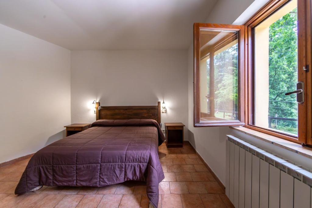 Postel nebo postele na pokoji v ubytování Agriturismo La Ferrera