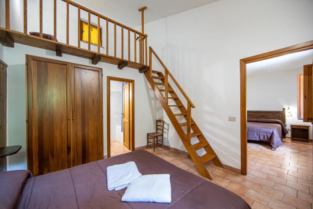Postel nebo postele na pokoji v ubytování Agriturismo La Ferrera