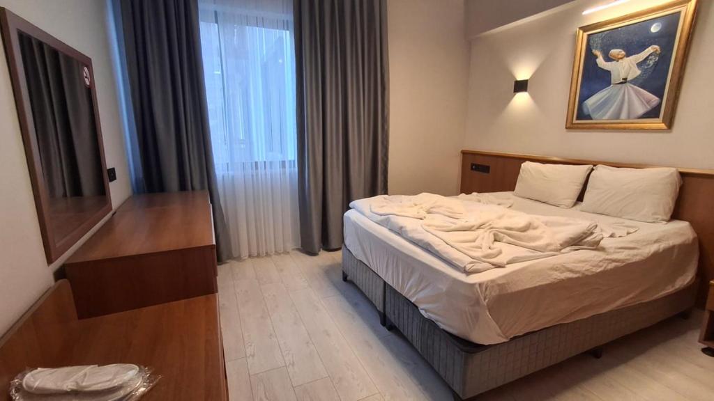 Postel nebo postele na pokoji v ubytování Orange Garden Aparts & Hotel THE NORDIC