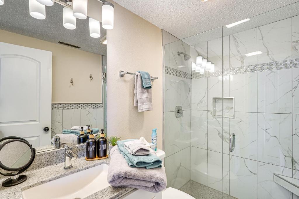 a bathroom with a sink and a shower at Lake and Pool Access Lazy Days Condo with Balcony! in Osage Beach