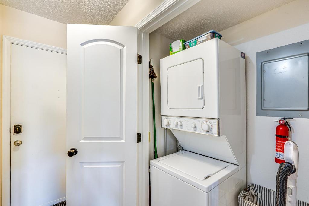 a small laundry room with a washer and dryer at Lake and Pool Access Lazy Days Condo with Balcony! in Osage Beach