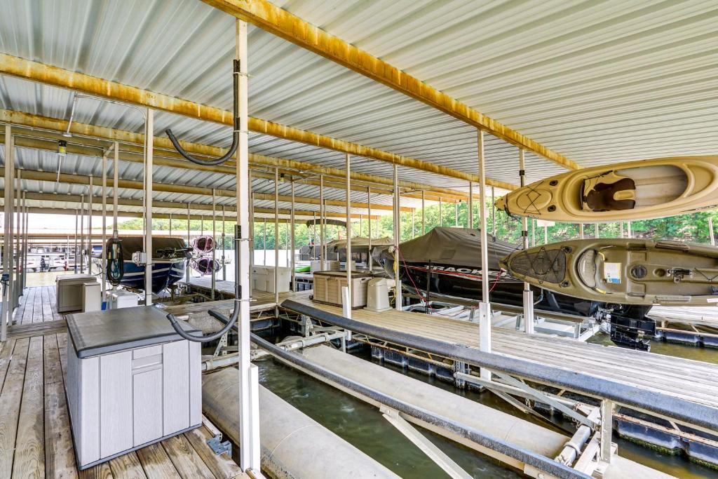 a museum with a bunch of boats on display at Lake and Pool Access Lazy Days Condo with Balcony! in Osage Beach
