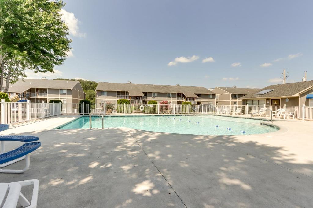 a swimming pool at a apartment complex at Lake and Pool Access Lazy Days Condo with Balcony! in Osage Beach