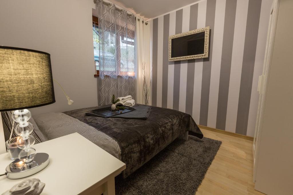 Televízia a/alebo spoločenská miestnosť v ubytovaní Grey Mountain