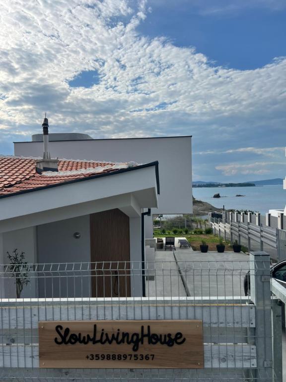 a building with a sign that reads snowmobiling house at Slow Living House in Lozenets