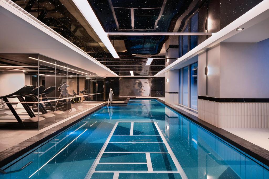 a large swimming pool with blue water in a building at Marsden Viaduct in Auckland