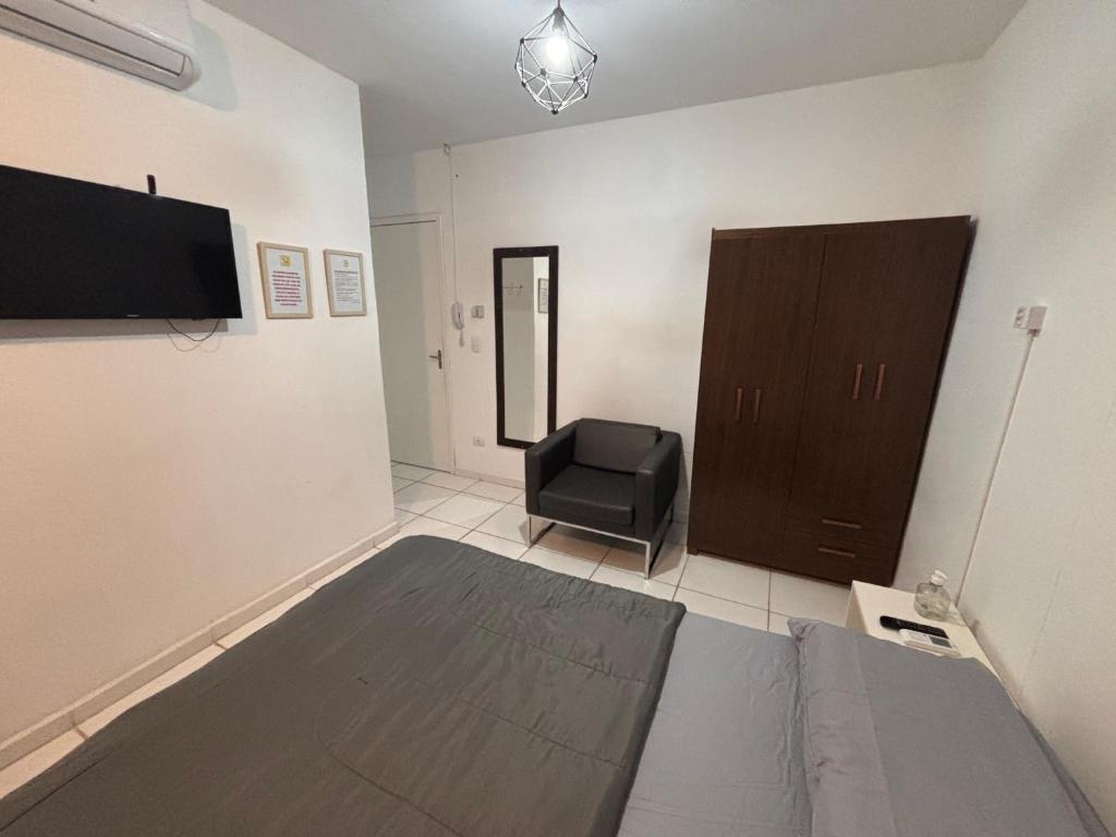 TV a/nebo společenská místnost v ubytování Hostel Pousada Curitiba Budget