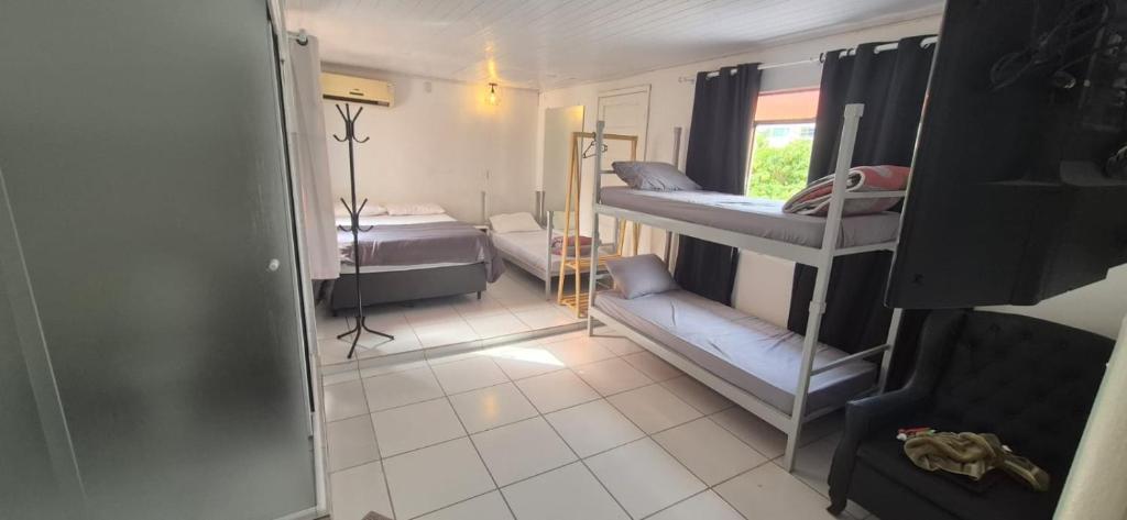 Postel nebo postele na pokoji v ubytování Hostel Pousada Curitiba Budget