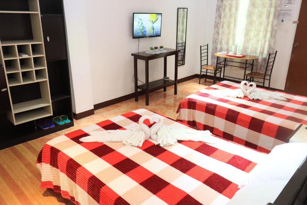 Postel nebo postele na pokoji v ubytování Point Vista Transient Accomodation