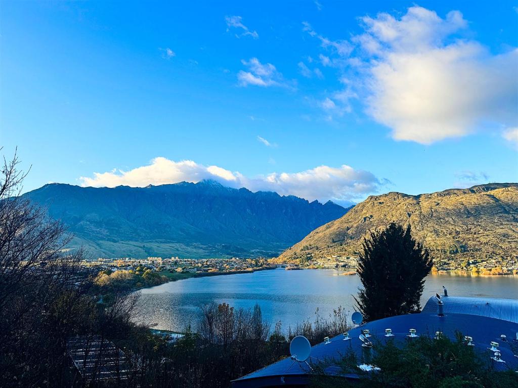 a view of a lake with mountains in the background at 3BR Lakeview Home with Balcony, Parking, Near Marina in Queenstown