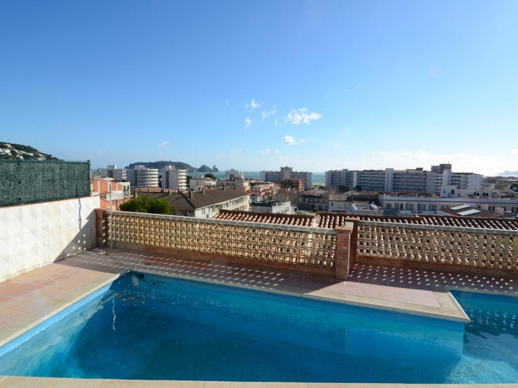 a swimming pool on the roof of a building at Apartment in Spain near Sandy Beach in L'Estartit