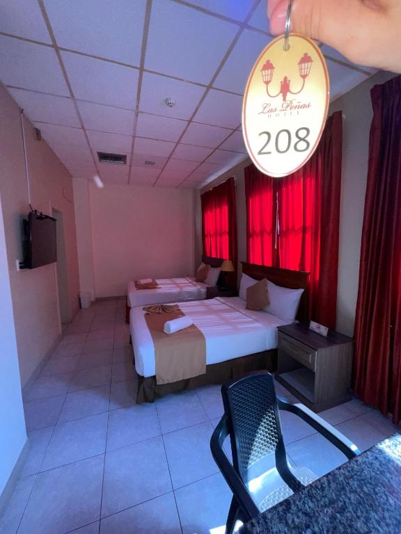 Postel nebo postele na pokoji v ubytování Hotel Las Peñas
