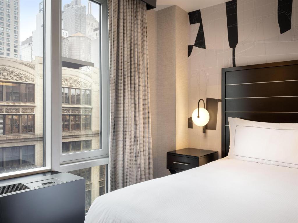 Cama ou camas em um quarto em Hilton New York Fashion District