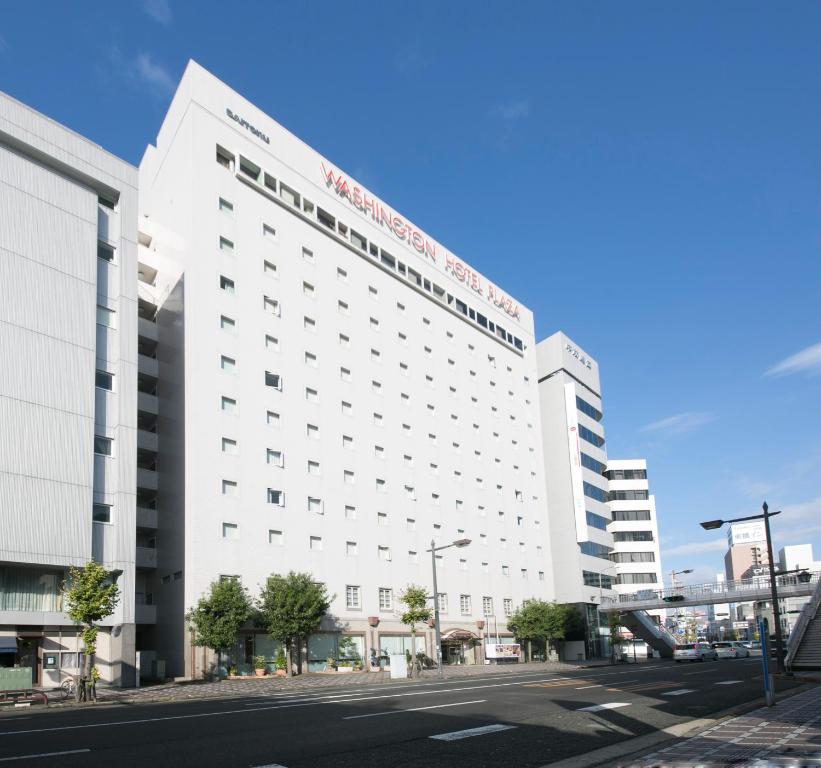 a large white building on a city street at Tokushima Washington Hotel Plaza in Tokushima