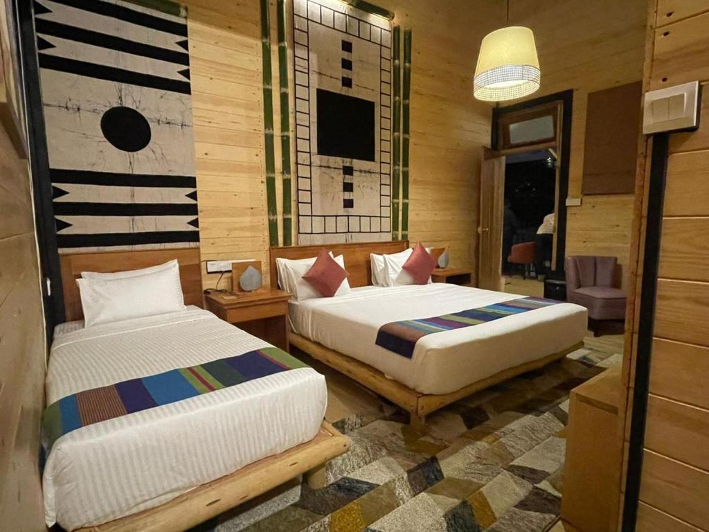 Postel nebo postele na pokoji v ubytování The Feel Luxury Boutique Hotel Ella