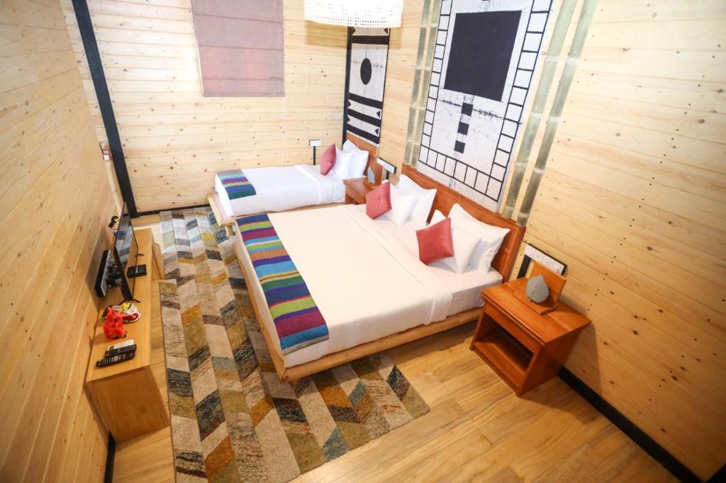 Postel nebo postele na pokoji v ubytování The Feel Luxury Boutique Hotel Ella