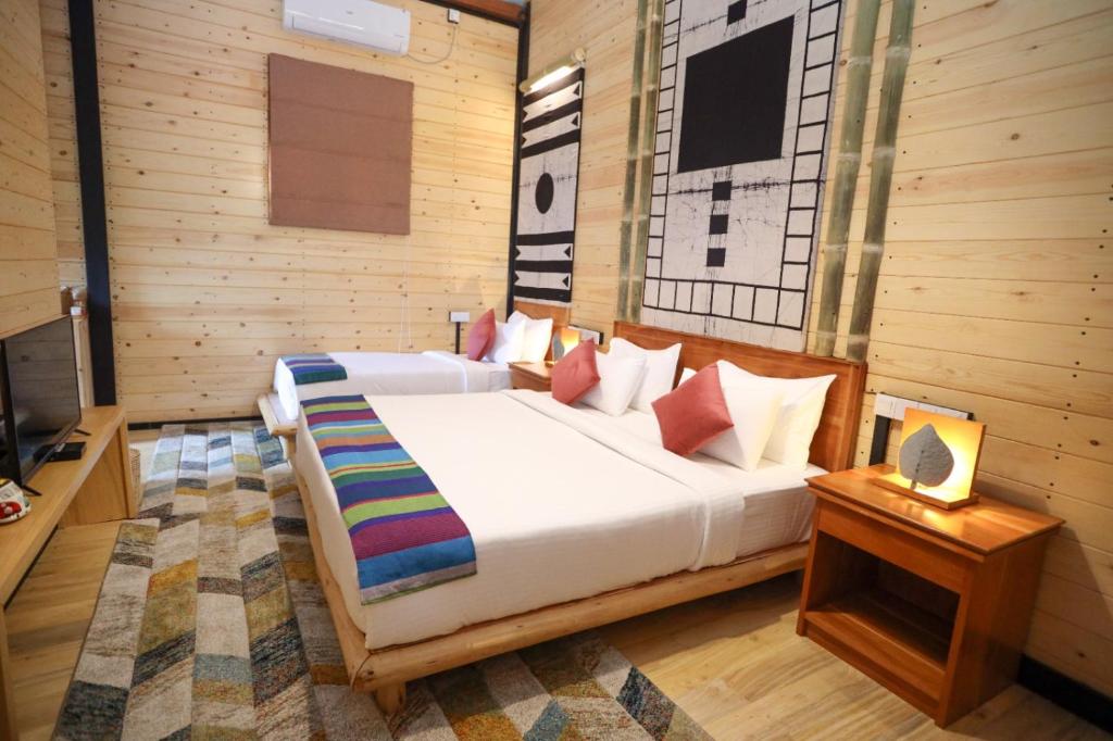 Postel nebo postele na pokoji v ubytování The Feel Luxury Boutique Hotel Ella