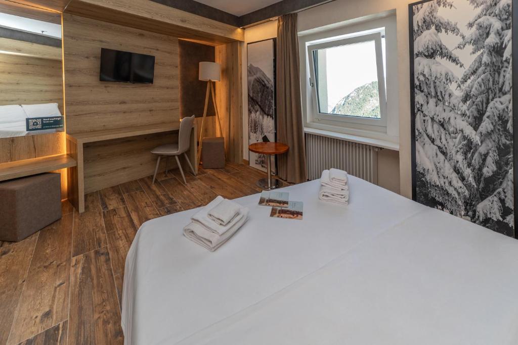 Postel nebo postele na pokoji v ubytování Hotel la Torre