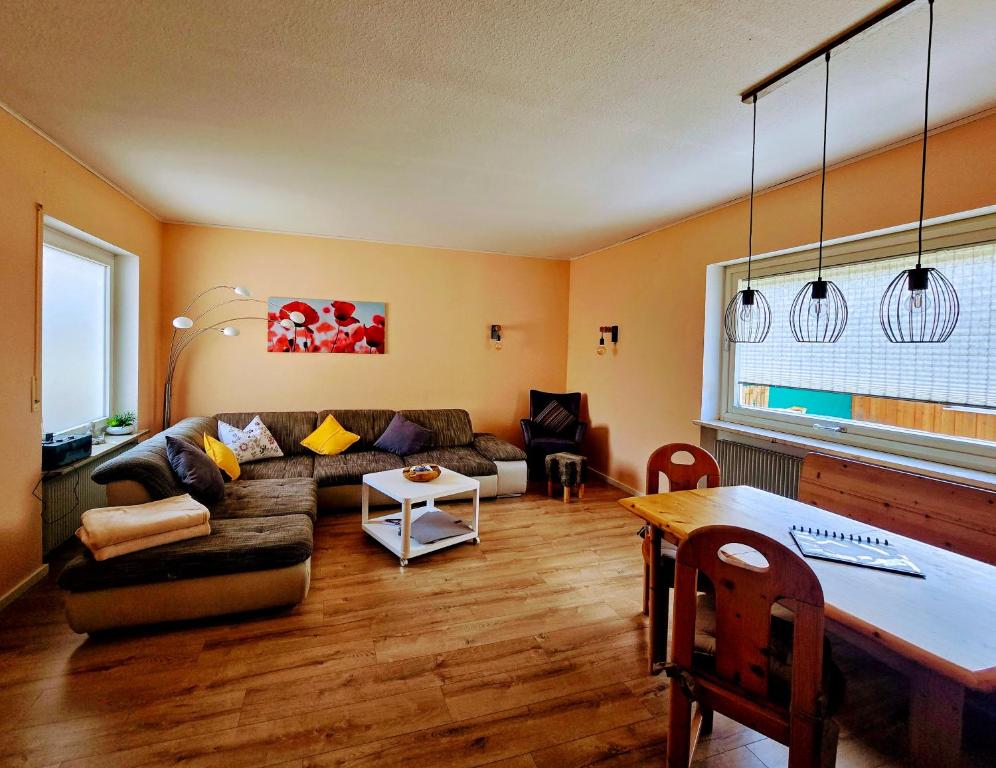 a living room with a couch and a table at Ferienwohnung Gruner - Cadolzburg - in Cadolzburg