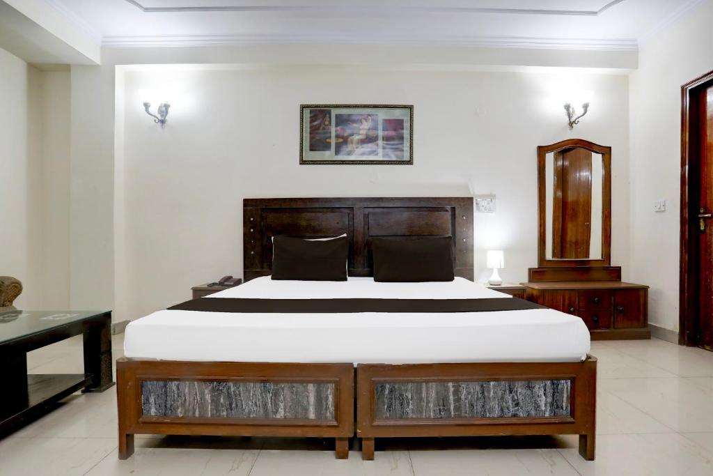 Postel nebo postele na pokoji v ubytování Hotel O Golden