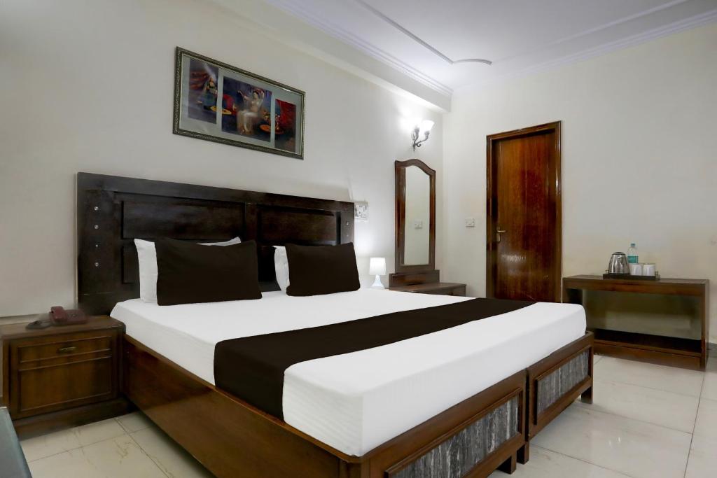 Postel nebo postele na pokoji v ubytování Hotel O Golden