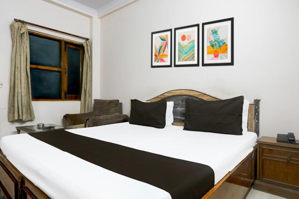 Postel nebo postele na pokoji v ubytování Hotel O Golden
