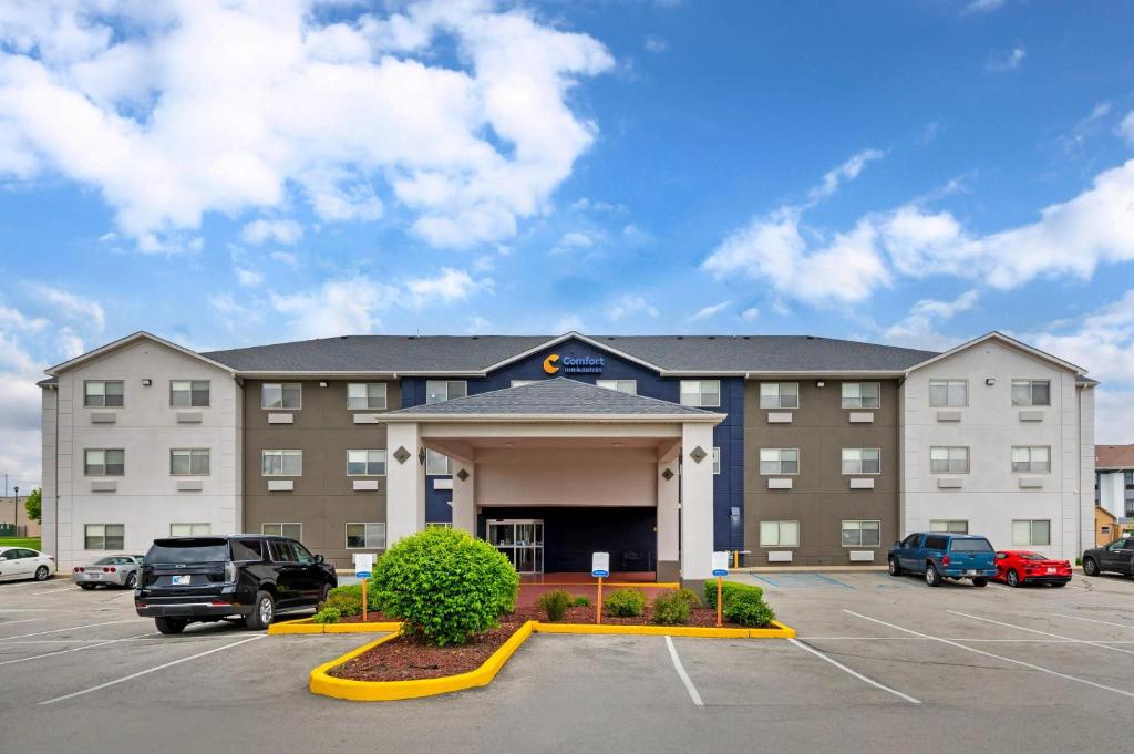 a hotel with a parking lot in front of it at Comfort Inn & Suites North Greenfield in Greenfield