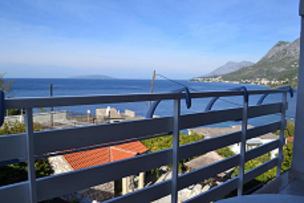 a balcony with a view of the ocean at Apartments Anita in Gradac