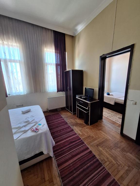 Postel nebo postele na pokoji v ubytování Gold Hotel Batum