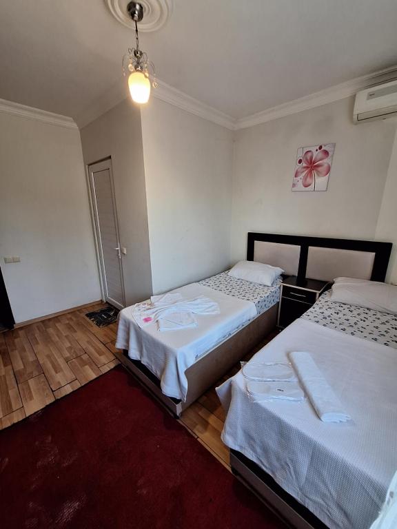 Postel nebo postele na pokoji v ubytování Gold Hotel Batum