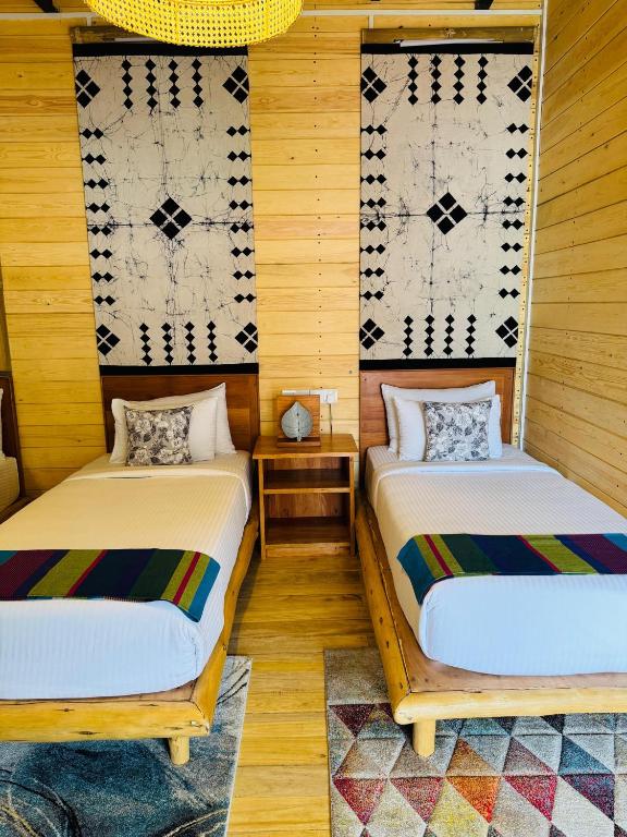 Postel nebo postele na pokoji v ubytování The Feel Luxury Boutique Hotel Ella