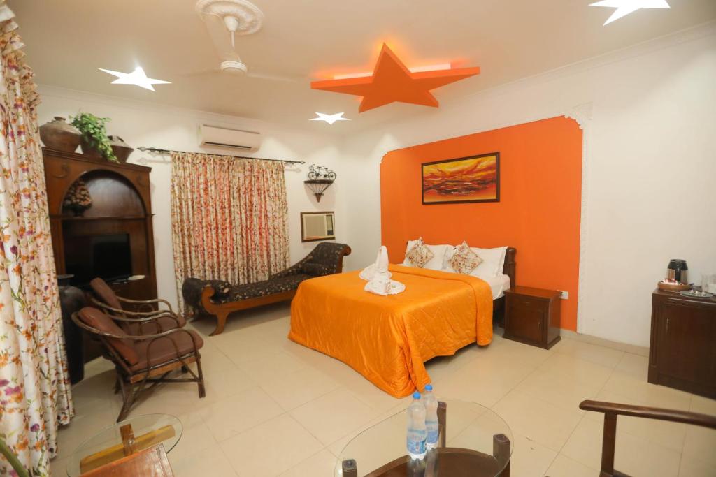 Postel nebo postele na pokoji v ubytování Hotel Goan Heritage