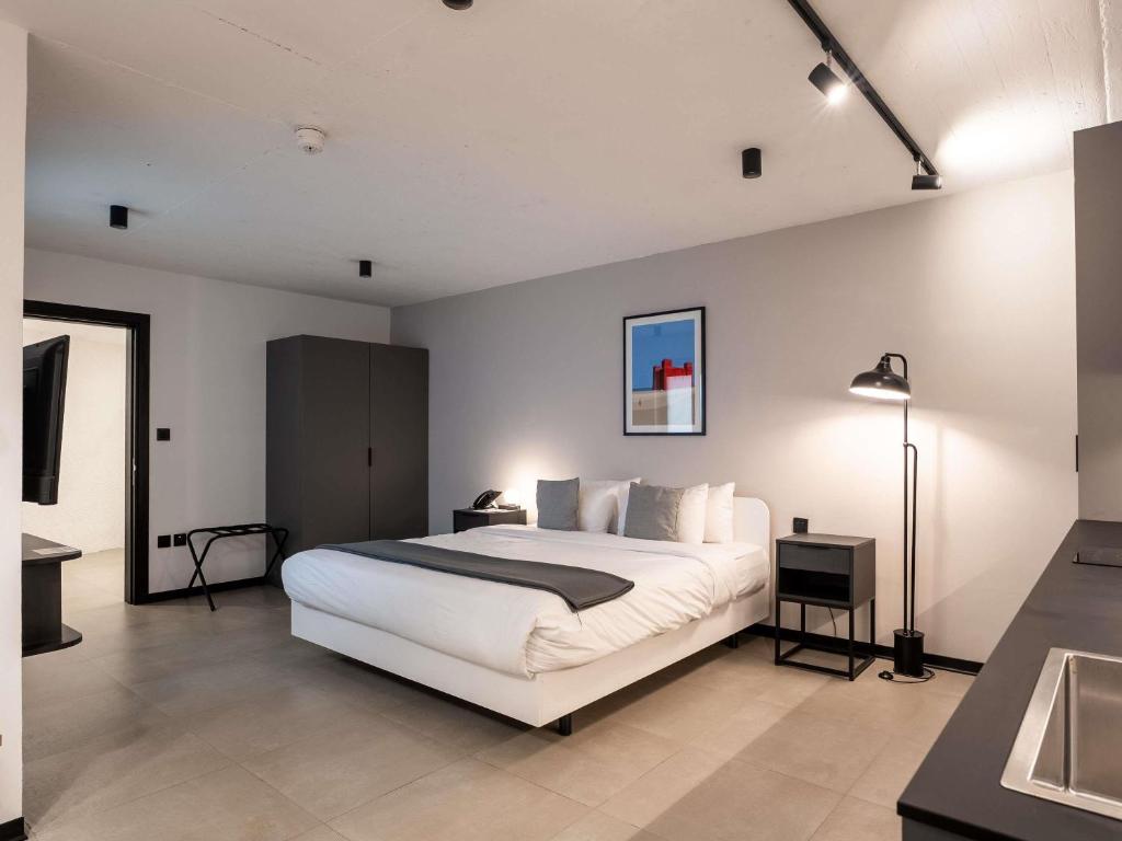 Postel nebo postele na pokoji v ubytování Aparthotel Adagio Malta Central