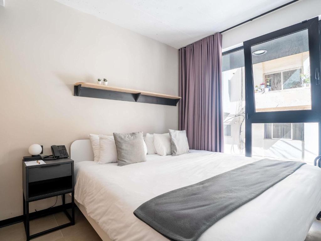 Postel nebo postele na pokoji v ubytování Aparthotel Adagio Malta Central