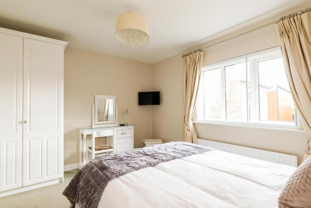 Postel nebo postele na pokoji v ubytování Sea Mist Guesthouse