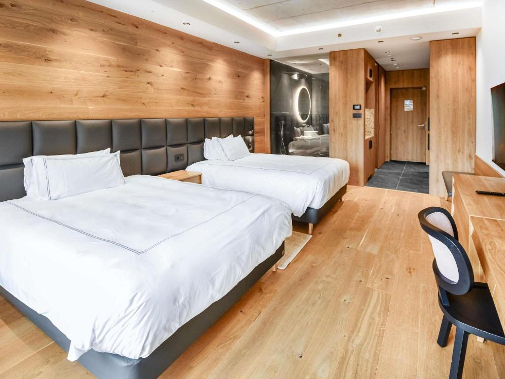 Posteľ alebo postele v izbe v ubytovaní Swissôtel Damian Jasna
